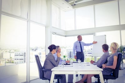 businessman-giving-presentation-to-his-colleagues